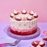 Raspberry & White Chocolate Cake with layers, white chocolate truffles, raspberry meringue, gold leaf by Crumbs & Doilies.